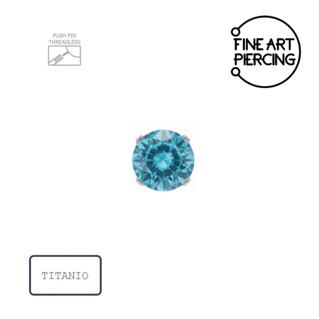Piercing push pin de titanio con una circonita azul engastada de 3mm.